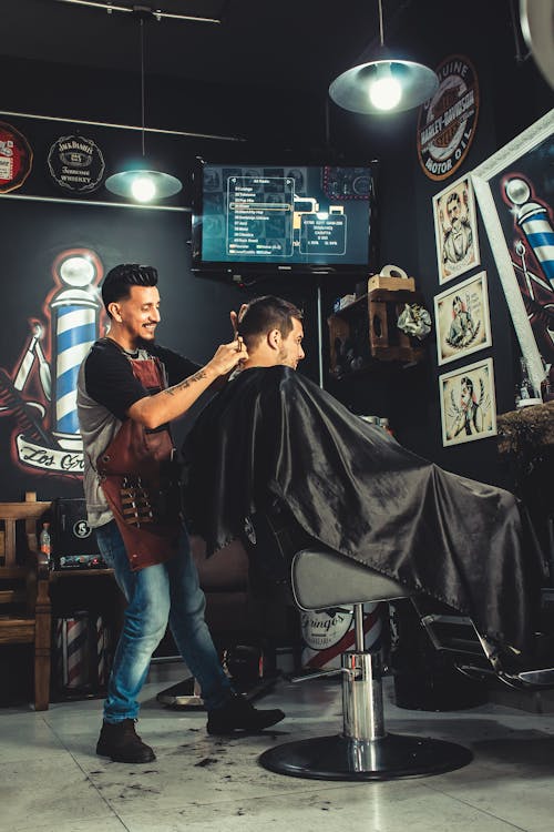 a barber and client in the